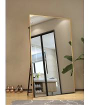 Напольное большое широкое зеркало в полный рост в золотой металлической раме на ножке-подставке Эмилия