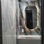 Овальное зеркало в тонкой металлической черной раме Ленора