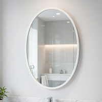 Овальное настенное зеркало в белой раме Лирия