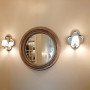 Круглое дизайнерское настенное зеркало в серебряной раме Римма