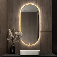 Зеркало с подсветкой капсульной формы в золотой раме Хелио