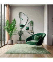 Настенное дизайнерское зеркало неправильной формы в зелёной раме Кадера